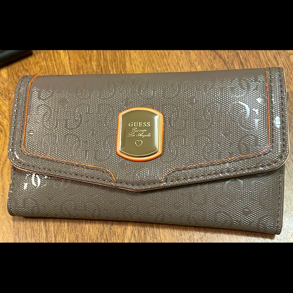 New Guess Multi Clutch Wallet Gray. New. Tiny bit of adhesive inside left corner